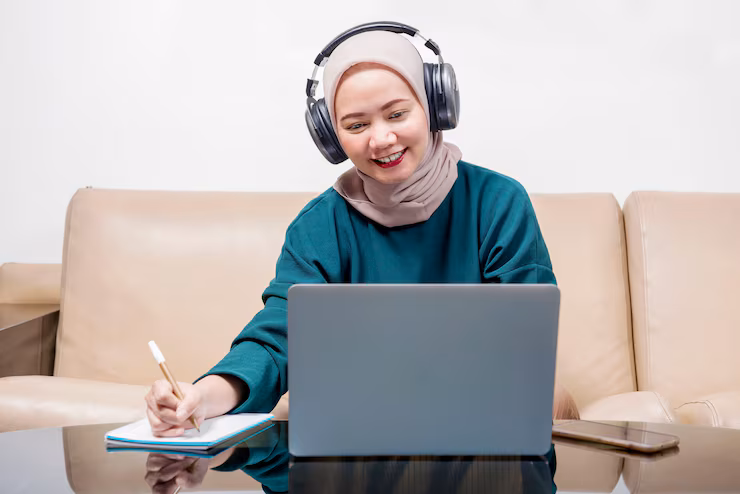 asian-muslim-businesswoman-using-laptop-working-from-home-prevent-flu-disease-Quran Tajweed Course Online